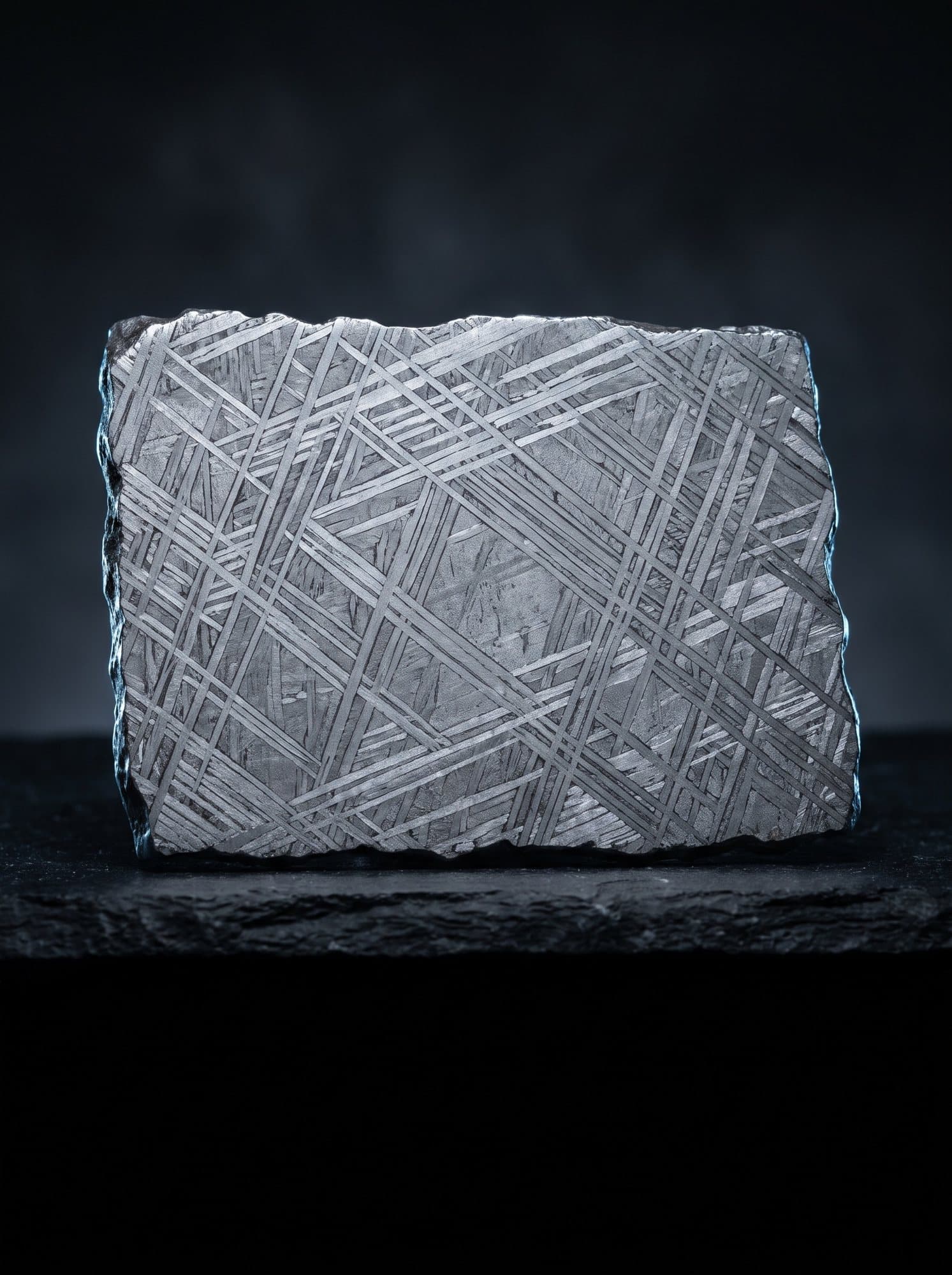 A slice of iron meteorite with a pattern of crossing bands